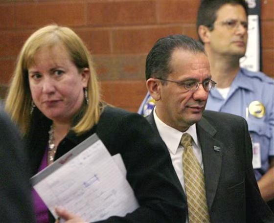 Hartford Mayor Eddie Perez, center, faces up to 60 years in prison after his conviction on five corruption charges.